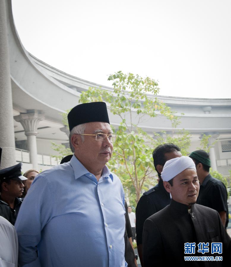 （马航客机失联·第7天）（2）马来西亚总理为失联航班上的人祈祷